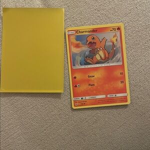 Charmander Pokémon Card with Yellow Sleeve